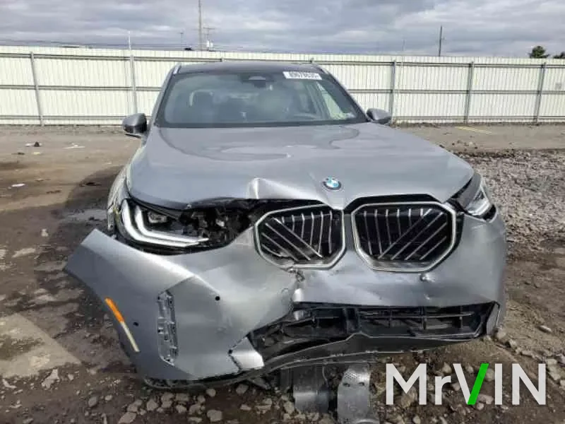 A 2025 BMW X3 with a crushed front end