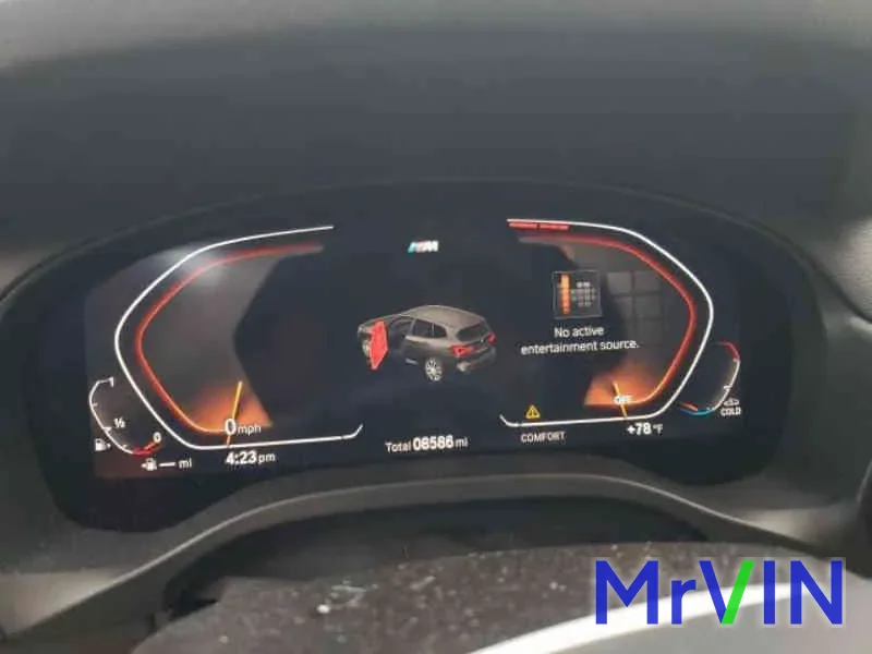 The X3 instrument cluster showing 8,586 miles